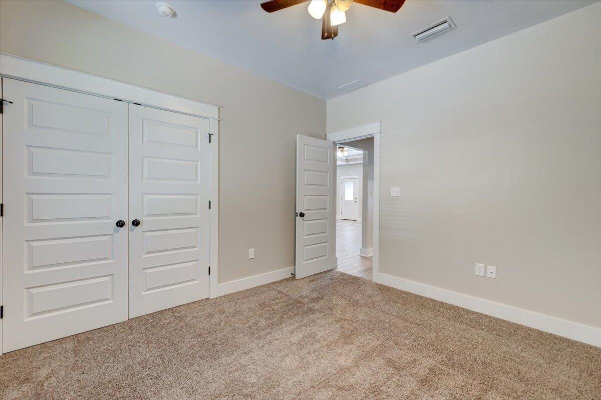 3956 Painter Branch Road Crestview, FL 32539 - Photo 16 of 28 an empty room with closet area