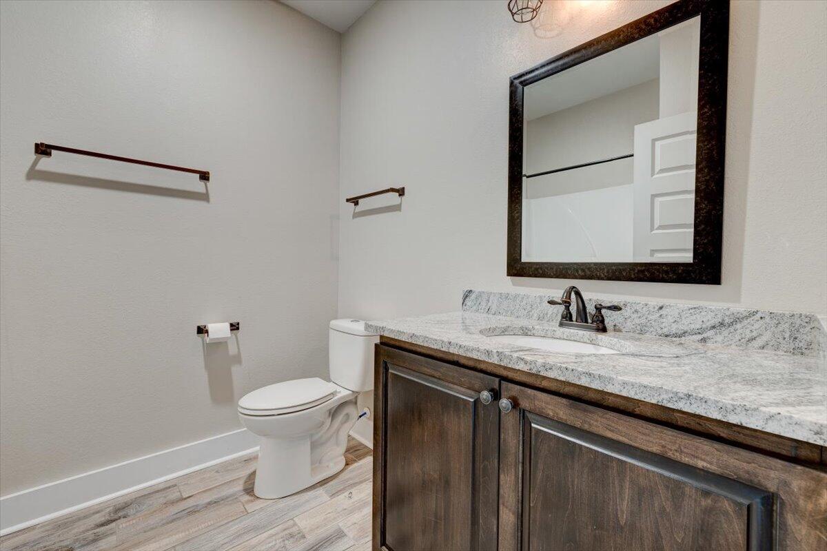 3956 Painter Branch Road Crestview, FL 32539 - Photo 19 of 28 a bathroom with a granite countertop sink toilet and mirror
