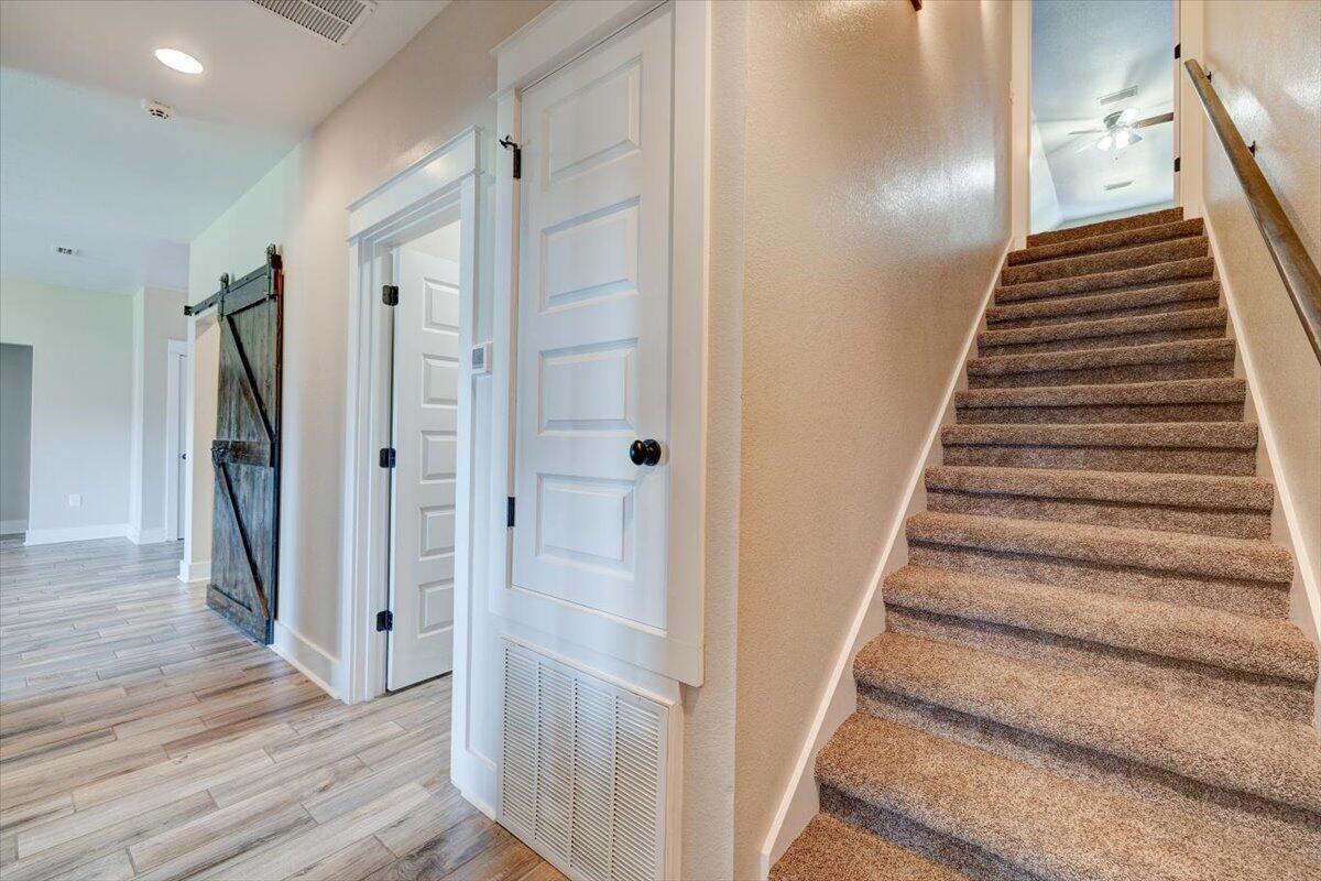 3956 Painter Branch Road Crestview, FL 32539 - Photo 22 of 28 a view of a hallway with wooden floor and entryway