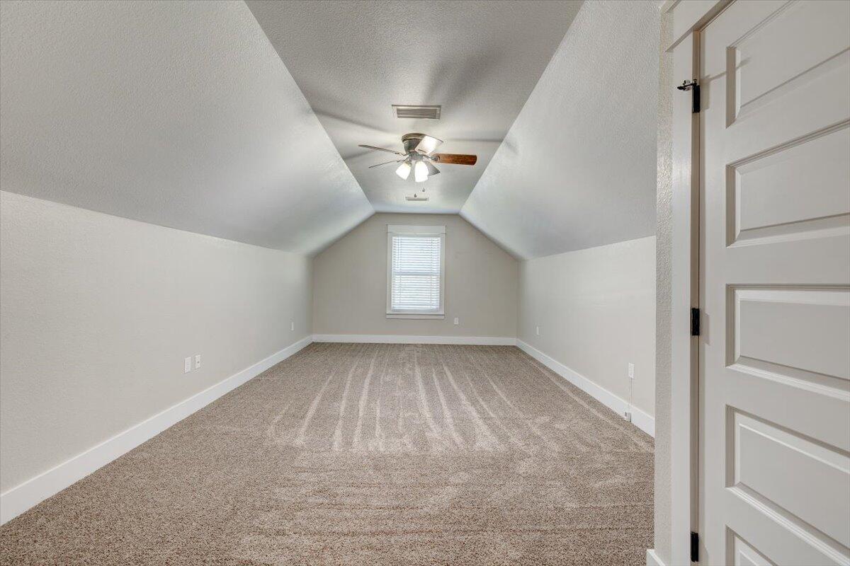 3956 Painter Branch Road Crestview, FL 32539 - Photo 23 of 28 wooden floor in an empty room with a window