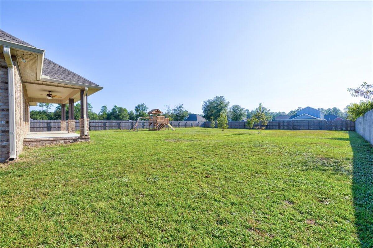 3956 Painter Branch Road Crestview, FL 32539 - Photo 27 of 28 a view of an house with backyard space and balcony