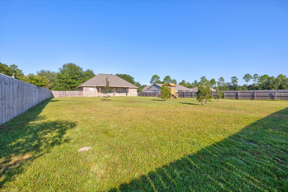 3956 Painter Branch Road Crestview, FL 32539 - Photo 28 of 28 a view of a lake with a big yard
