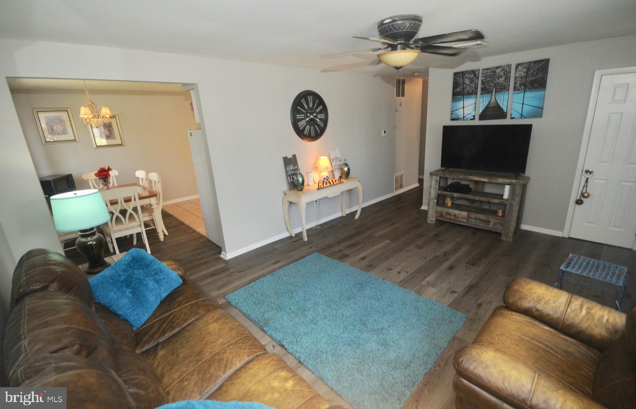 710 Blue Bell Road Williamstown, NJ 08094 - Photo 2 of 19 a living room with furniture and a flat screen tv