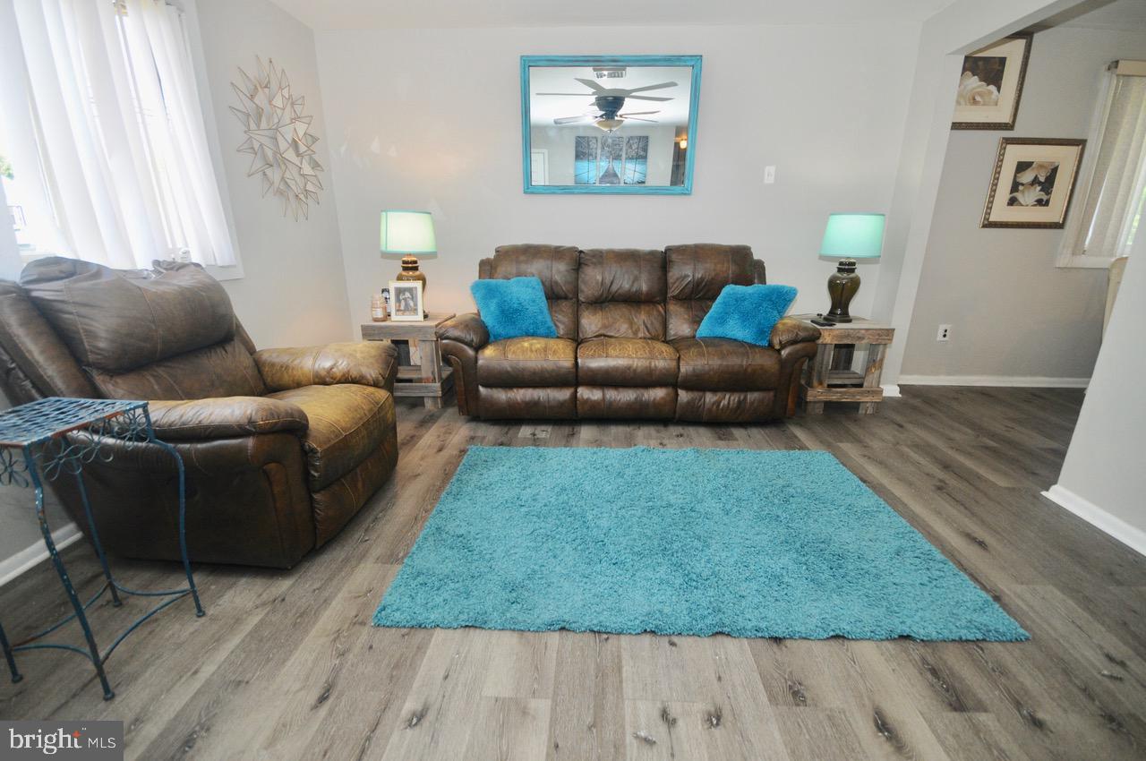 710 Blue Bell Road Williamstown, NJ 08094 - Photo 11 of 19 a living room with furniture and a rug