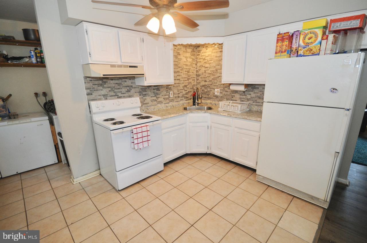 710 Blue Bell Road Williamstown, NJ 08094 - Photo 13 of 19 a kitchen with stainless steel appliances a stove a sink and a refrigerator