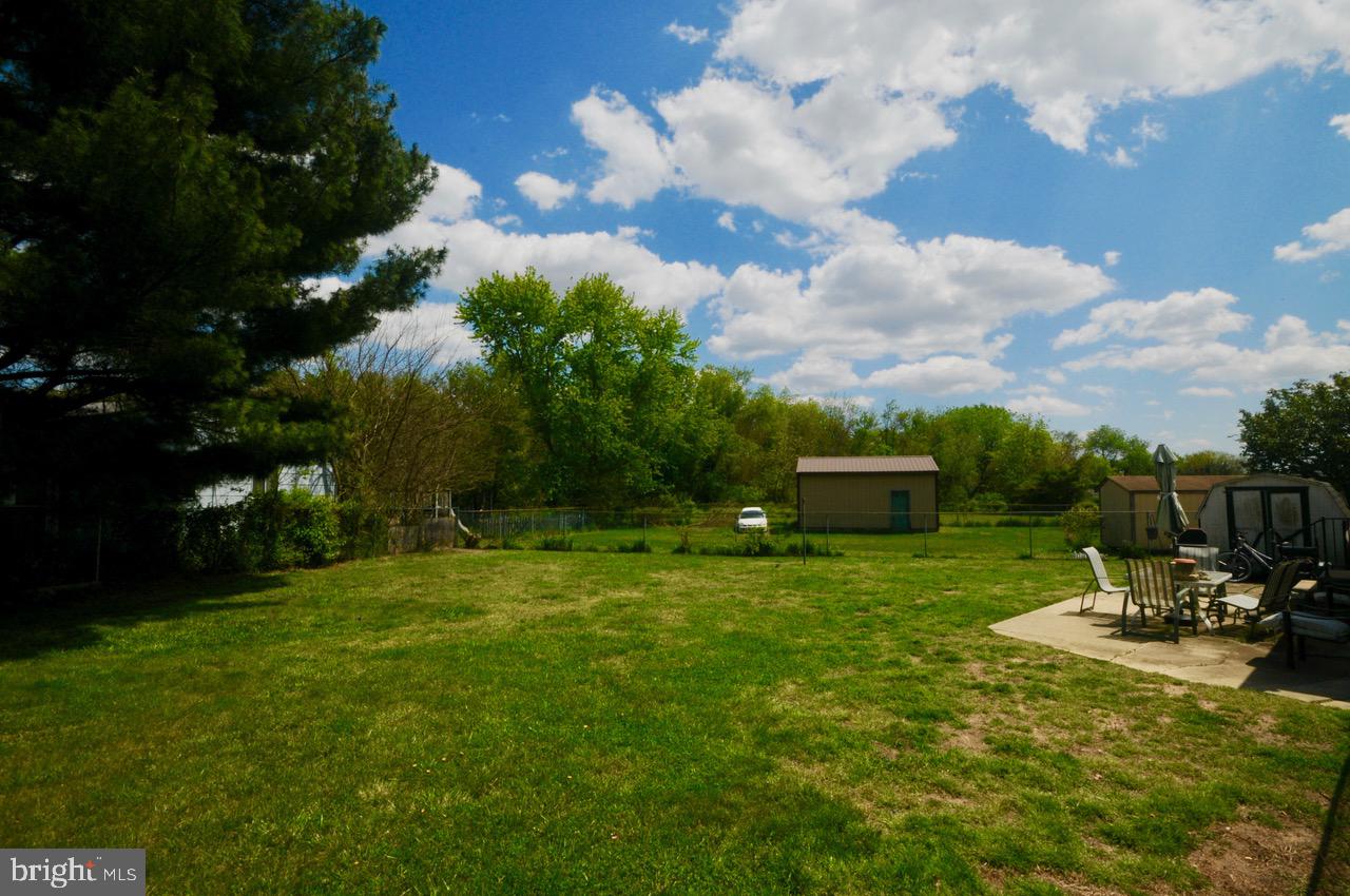 710 Blue Bell Road Williamstown, NJ 08094 - Photo 18 of 19 a garden with trees in the background