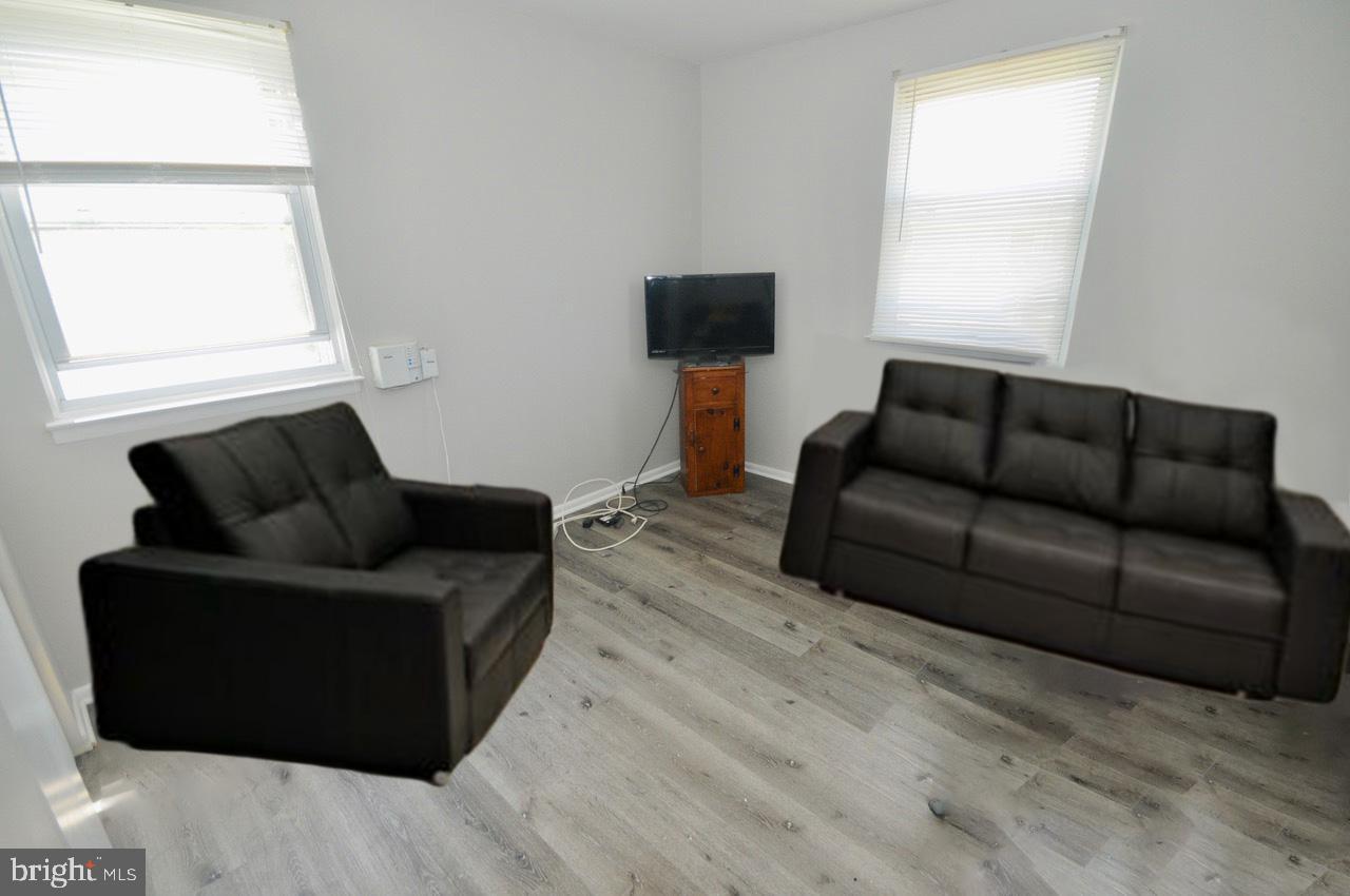 710 Blue Bell Road Williamstown, NJ 08094 - Photo 7 of 19 a living room with furniture and a window