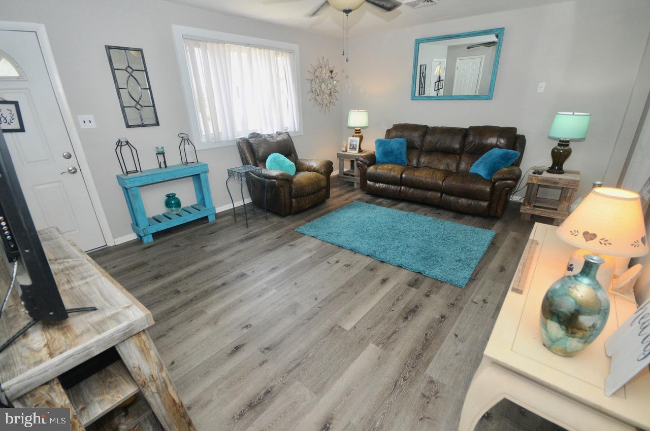 710 Blue Bell Road Williamstown, NJ 08094 - Photo 8 of 19 a living room with furniture and a wooden floor