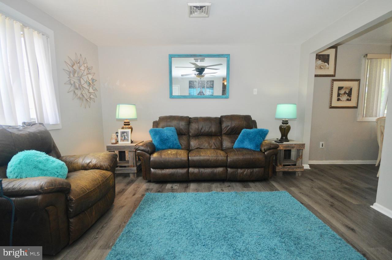 710 Blue Bell Road Williamstown, NJ 08094 - Photo 9 of 19 a living room with furniture and a couch