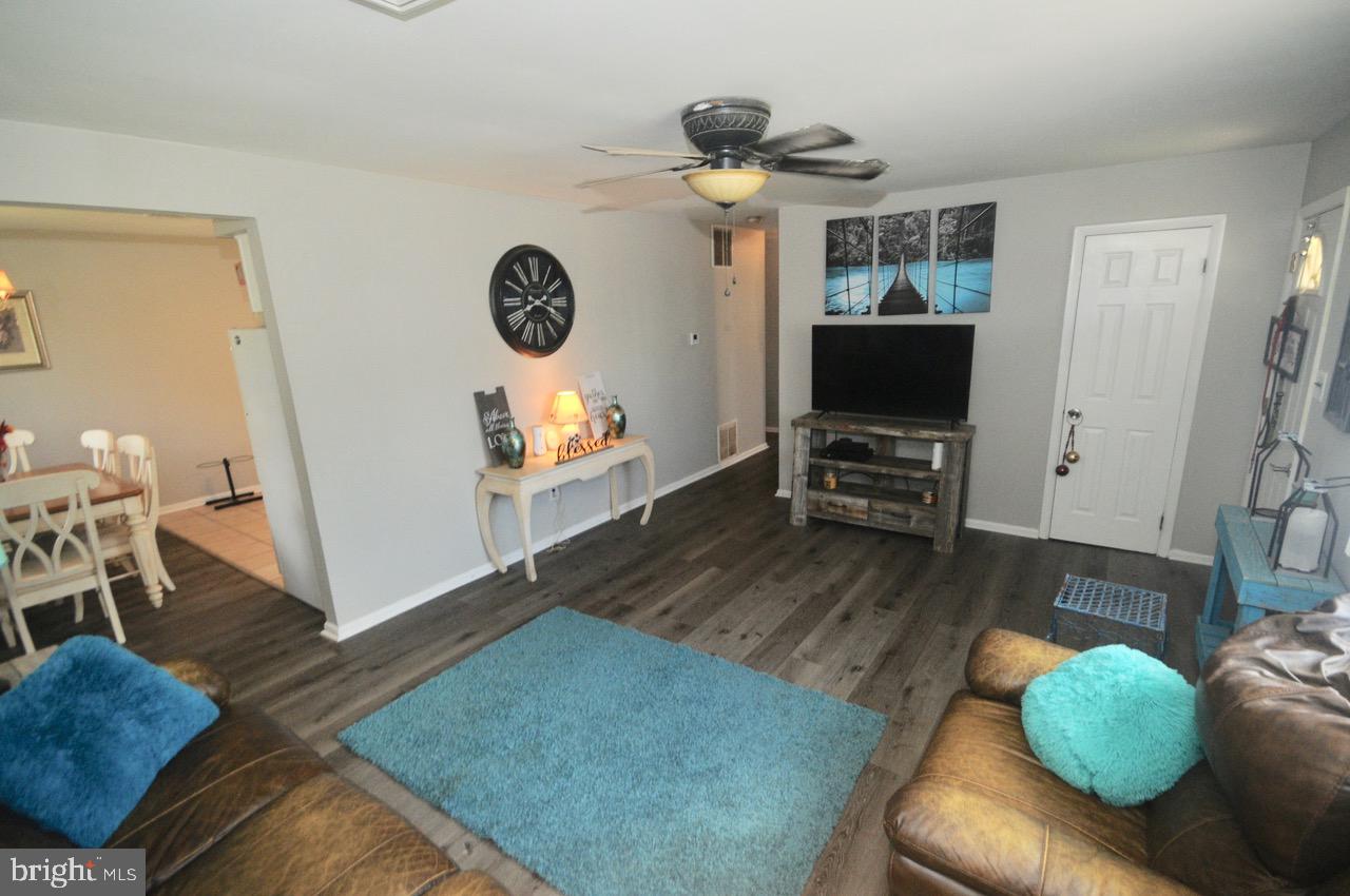 710 Blue Bell Road Williamstown, NJ 08094 - Photo 10 of 19 a living room with furniture and a flat screen tv
