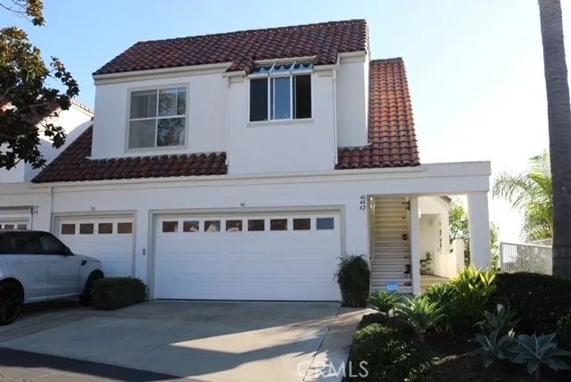 a view of a building with car parked