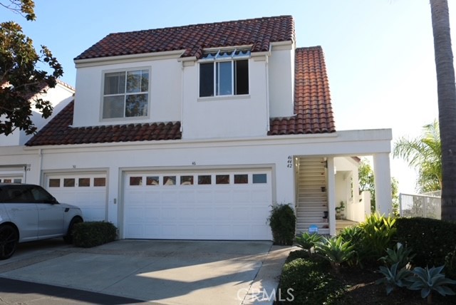 a view of a building with car parked