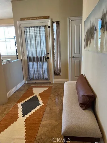 a living room with furniture and a rug