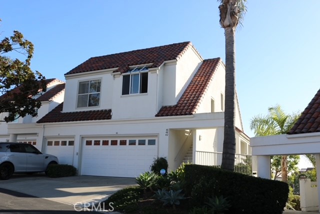 46 Los Cabos Dana Point, CA 92629 - Photo 2 of 37 a front view of a house with a garden
