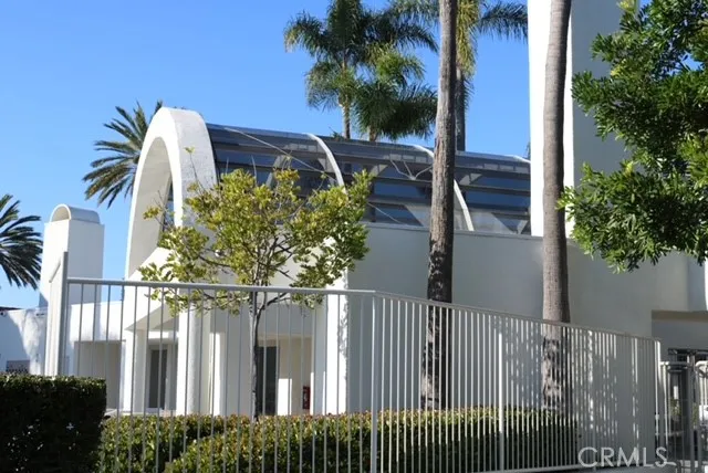 a view of a house with a small yard and plants