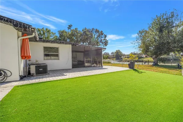 a view of a backyard with swimming pool
