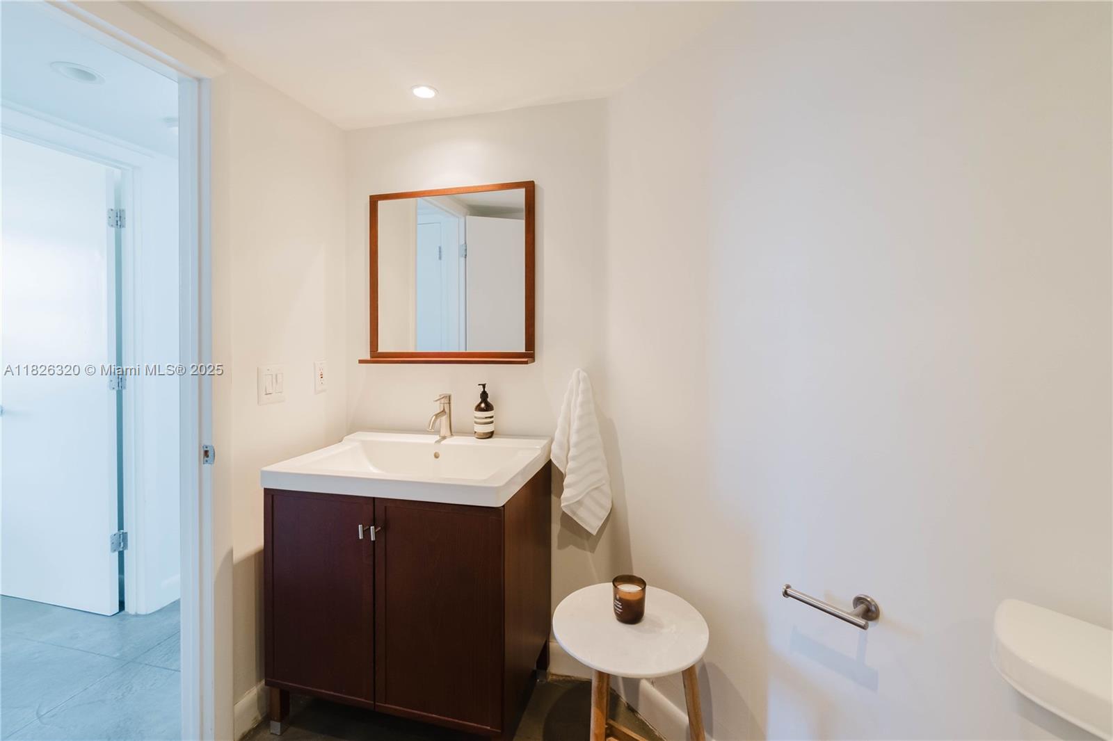 1900 Sunset Harbour Drive, Unit 703 Miami Beach, FL 33139 - Photo 12 of 22 a bathroom with a sink and a toilet