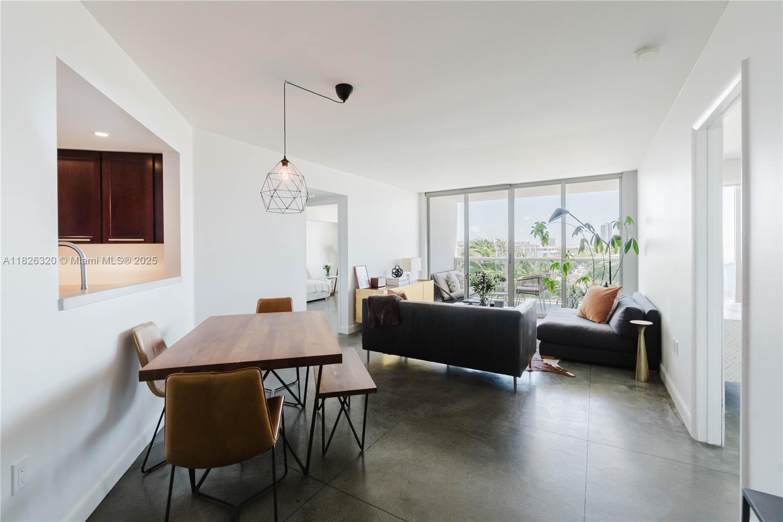 1900 Sunset Harbour Drive, Unit 703 Miami Beach, FL 33139 - Photo 4 of 22 a view of a dining room with furniture and wooden floor