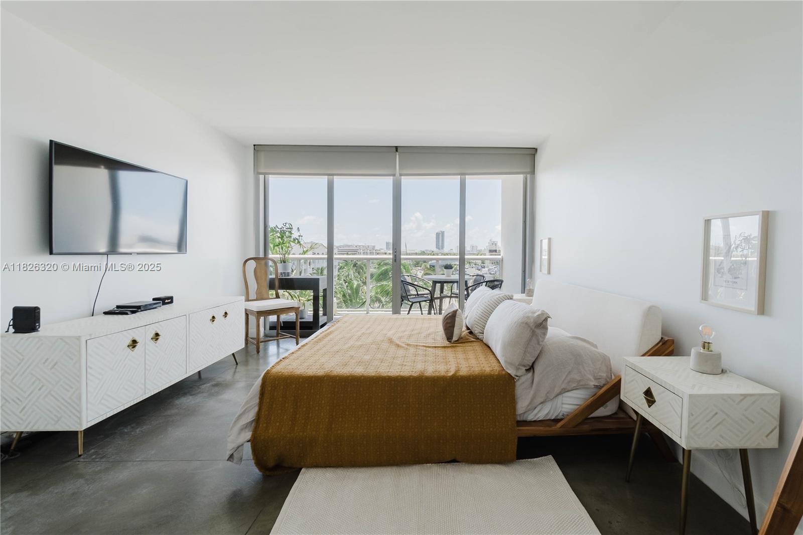 1900 Sunset Harbour Drive, Unit 703 Miami Beach, FL 33139 - Photo 7 of 22 a bedroom with a bed and a couch