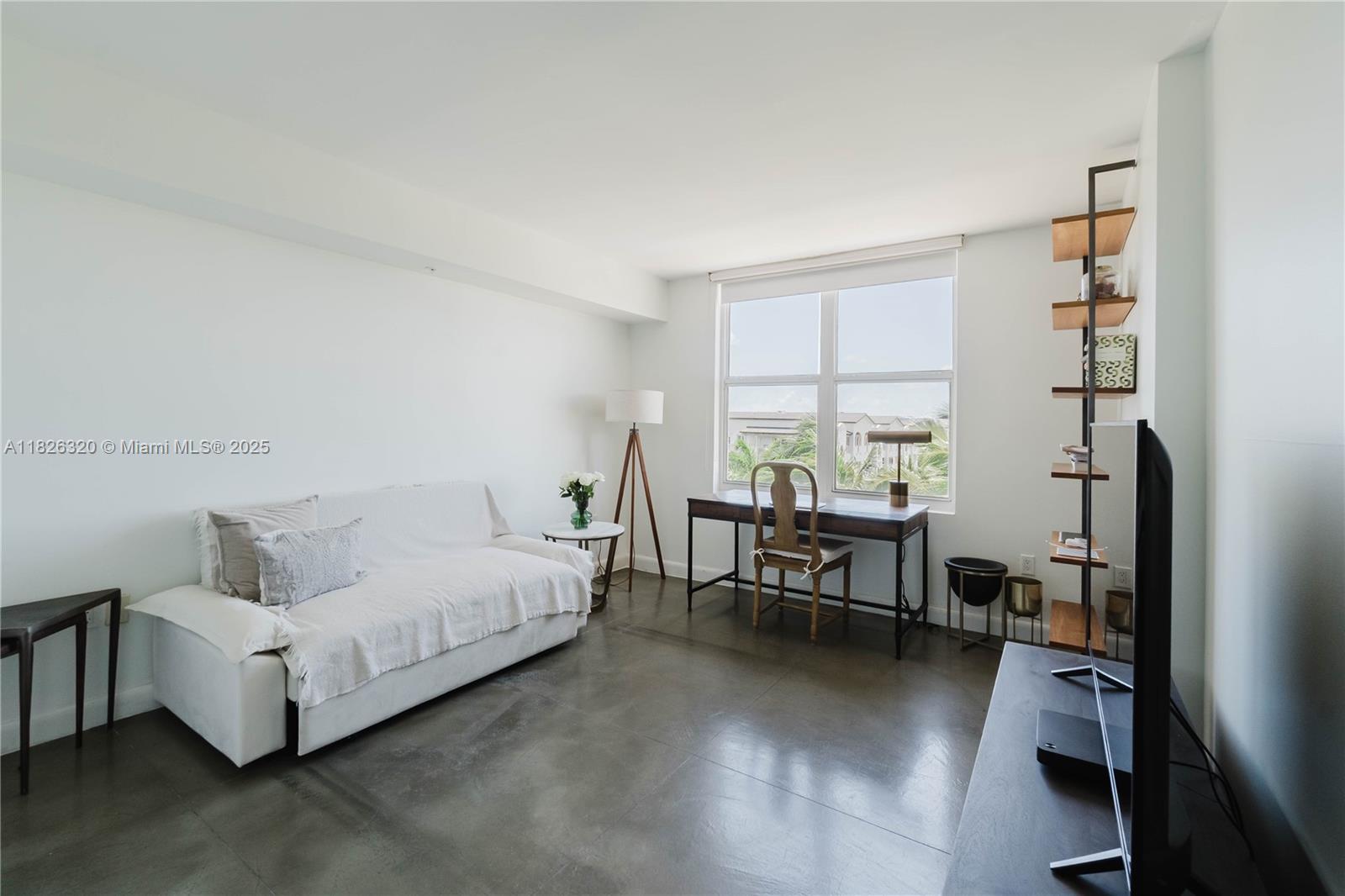 1900 Sunset Harbour Drive, Unit 703 Miami Beach, FL 33139 - Photo 9 of 22 a living room with furniture and a window