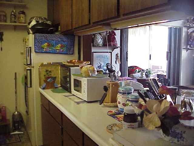 1993 South Kihei Road, Unit 615 Kihei, HI 96753 - Photo 11 of 16 a room with lots of appliances and cabinets
