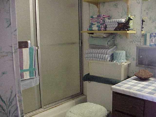 1993 South Kihei Road, Unit 615 Kihei, HI 96753 - Photo 13 of 16 a bathroom with a sink toilet and shower
