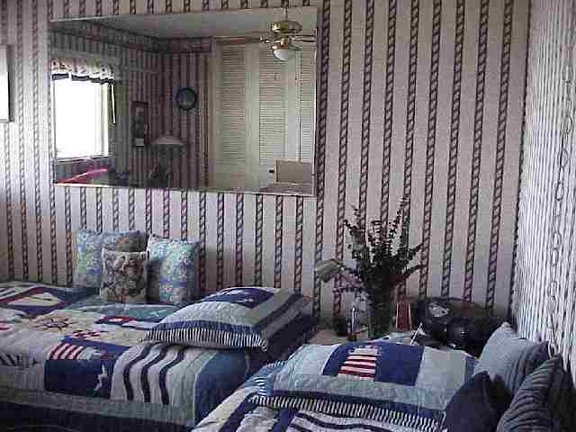 1993 South Kihei Road, Unit 615 Kihei, HI 96753 - Photo 15 of 16 a bedroom with a bed and a couch