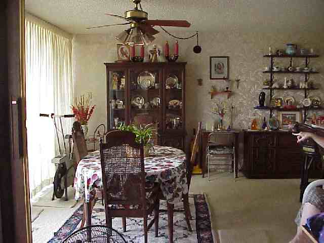 1993 South Kihei Road, Unit 615 Kihei, HI 96753 - Photo 8 of 16 a view of a dining room with furniture and chandelier