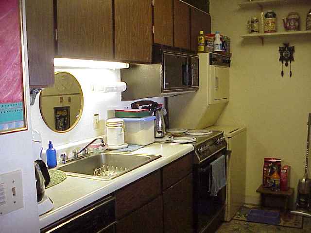 1993 South Kihei Road, Unit 615 Kihei, HI 96753 - Photo 10 of 16 a kitchen with a sink and a stove top oven