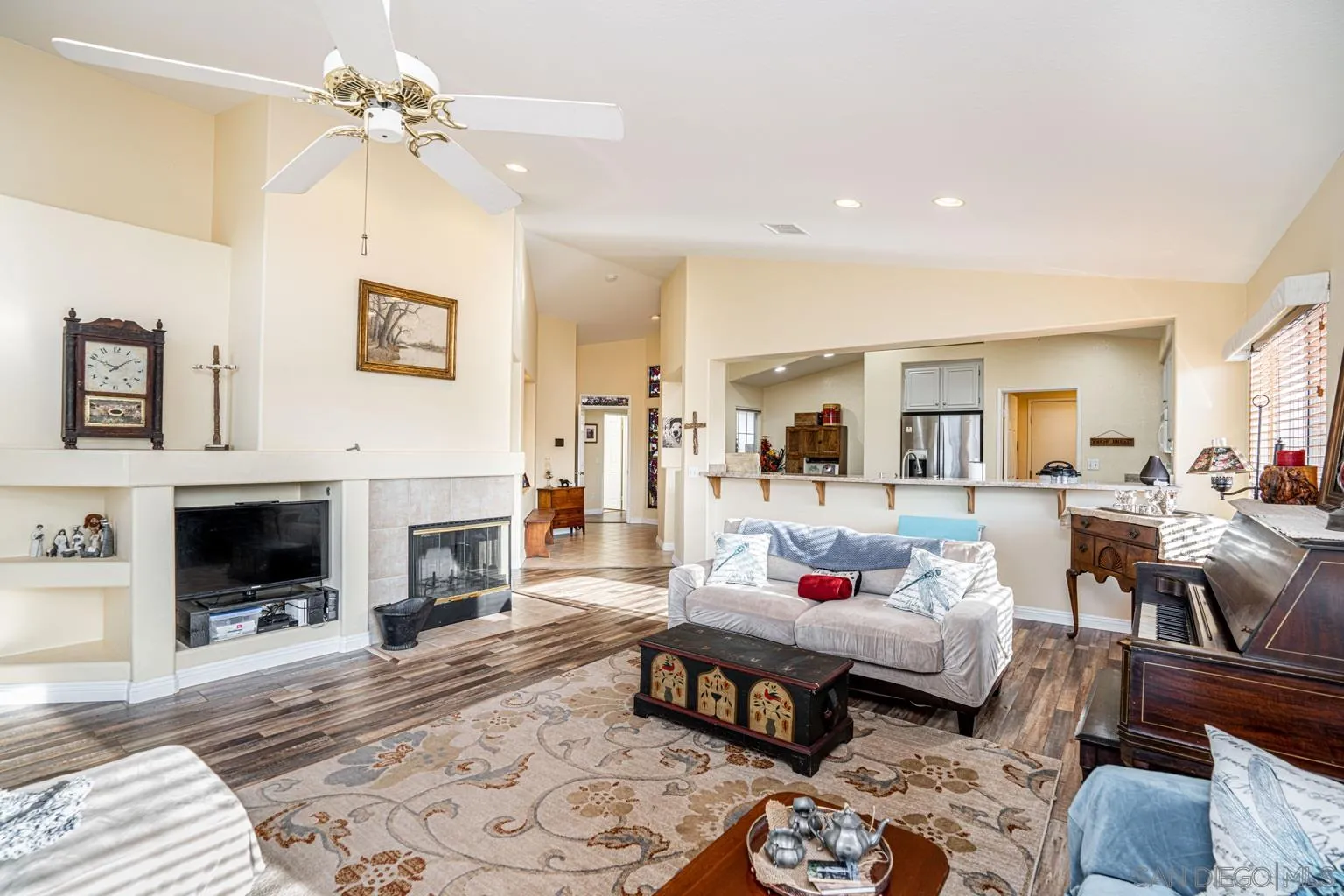 2602 Columbine Road Alpine, CA 91901 - Photo 2 of 38 a living room with furniture a fireplace and a table