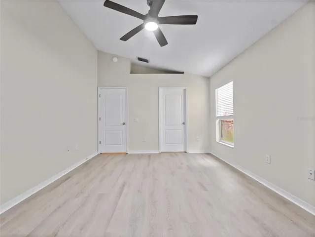 a view of an empty room with a window