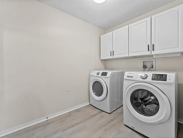 a utility room with dryer and washer