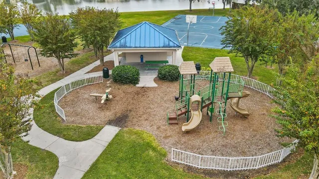 a view of a house with a yard potted plants