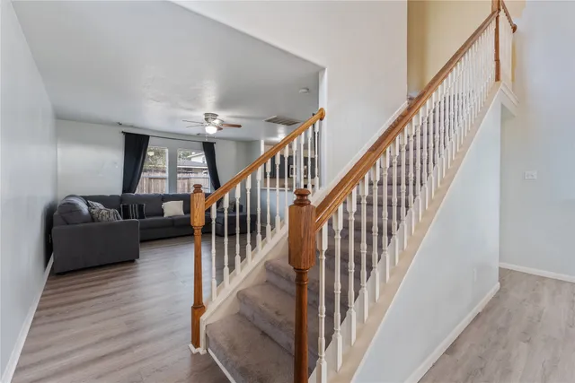 a view of staircase with wooden floor and stairs