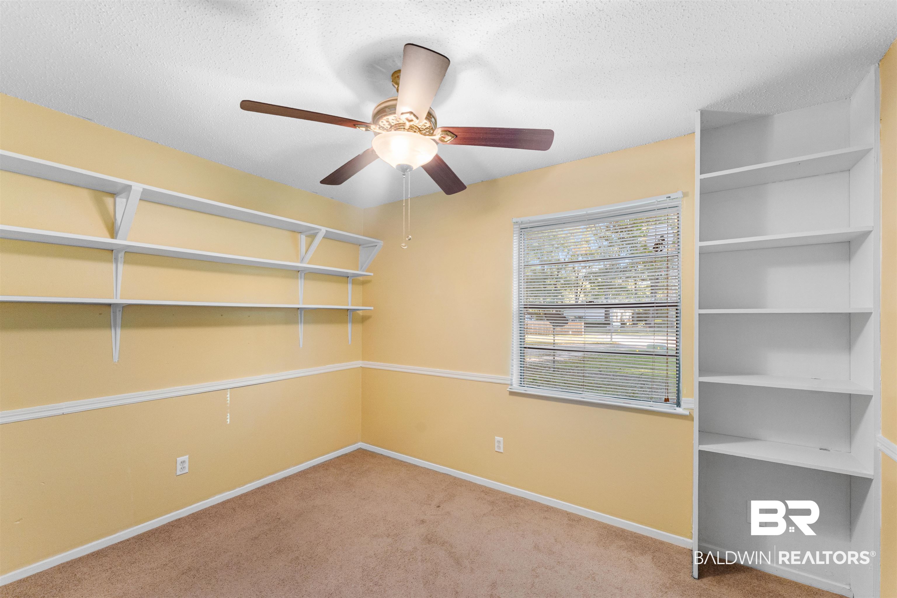 5551 Springer Court Theodore, AL 36582 - Photo 32 of 37 Empty room featuring light colored carpet, a textured ceiling, and ceiling fan