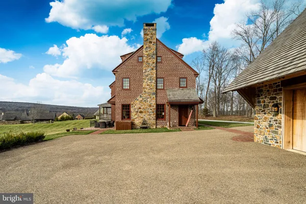 a view of a dining room with furniture wooden floor and chandelier