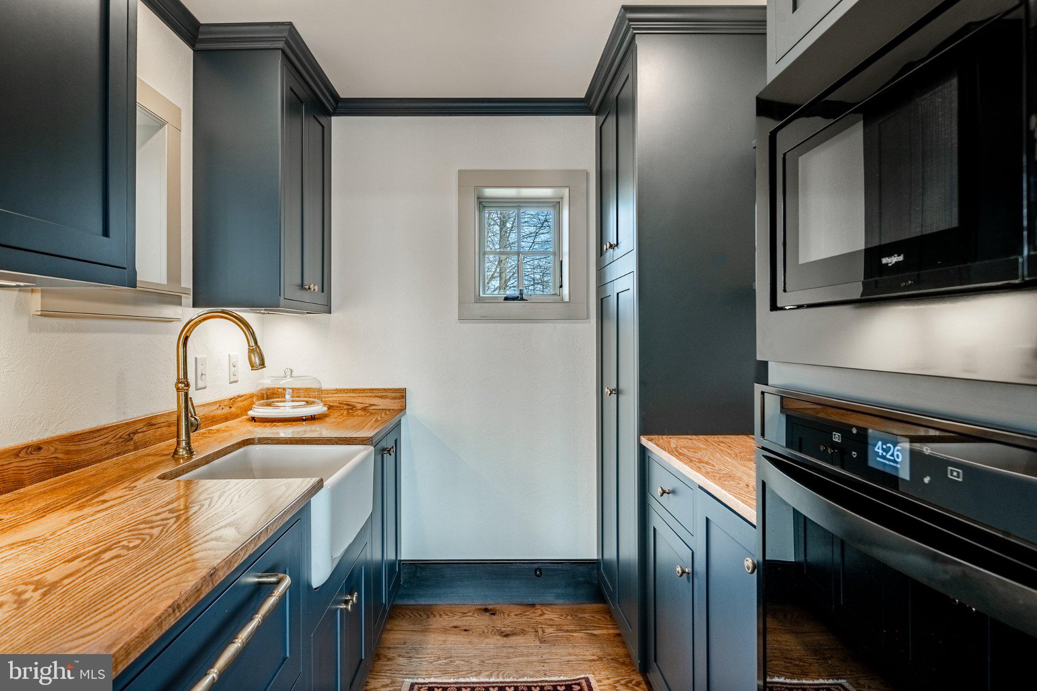 202 Privet Lane Elverson, PA 19520 - Photo 20 of 78 a kitchen with stainless steel appliances a stove a sink and a microwave