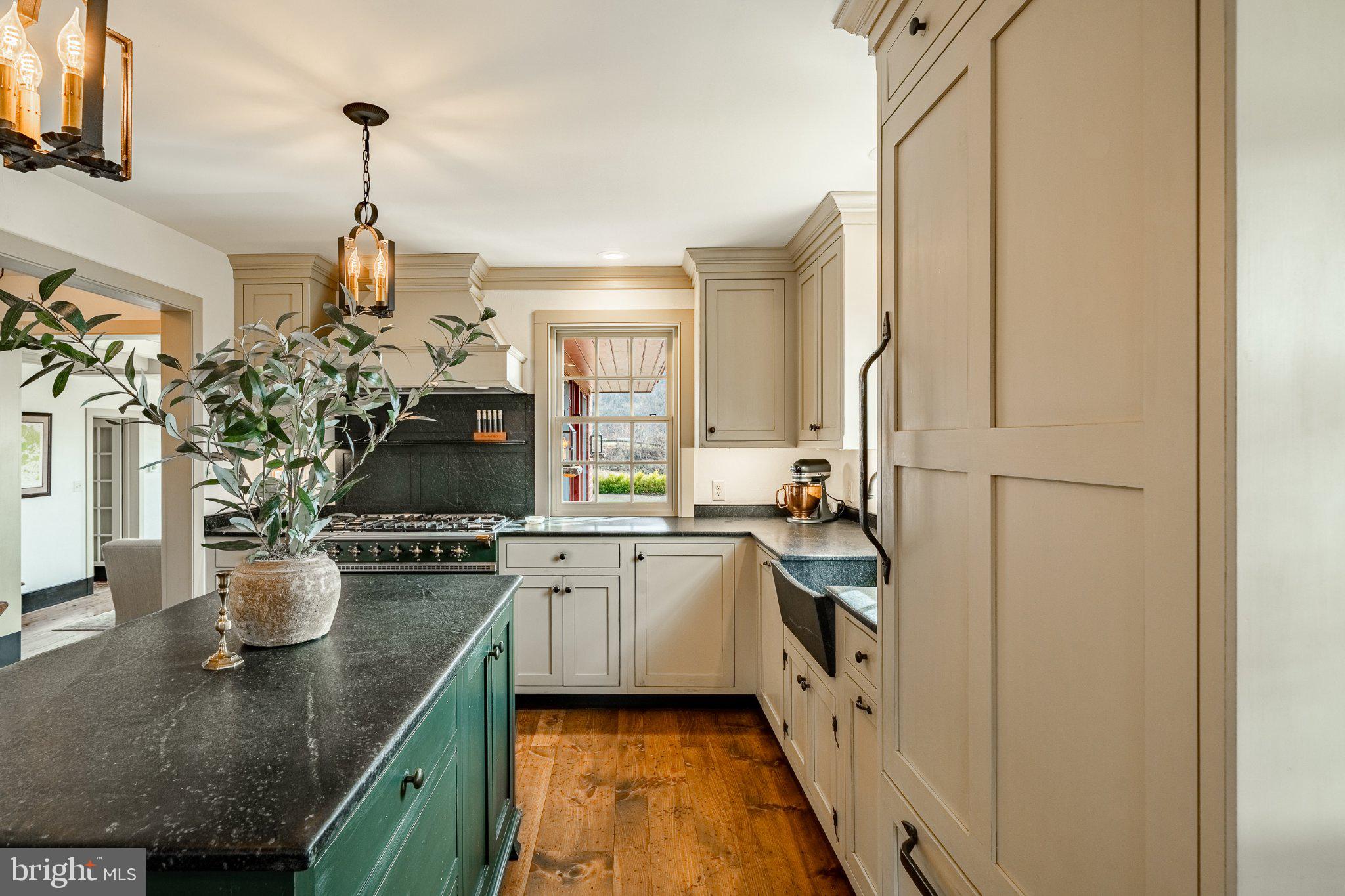 202 Privet Lane Elverson, PA 19520 - Photo 24 of 78 a kitchen with stainless steel appliances granite countertop a sink stove and refrigerator