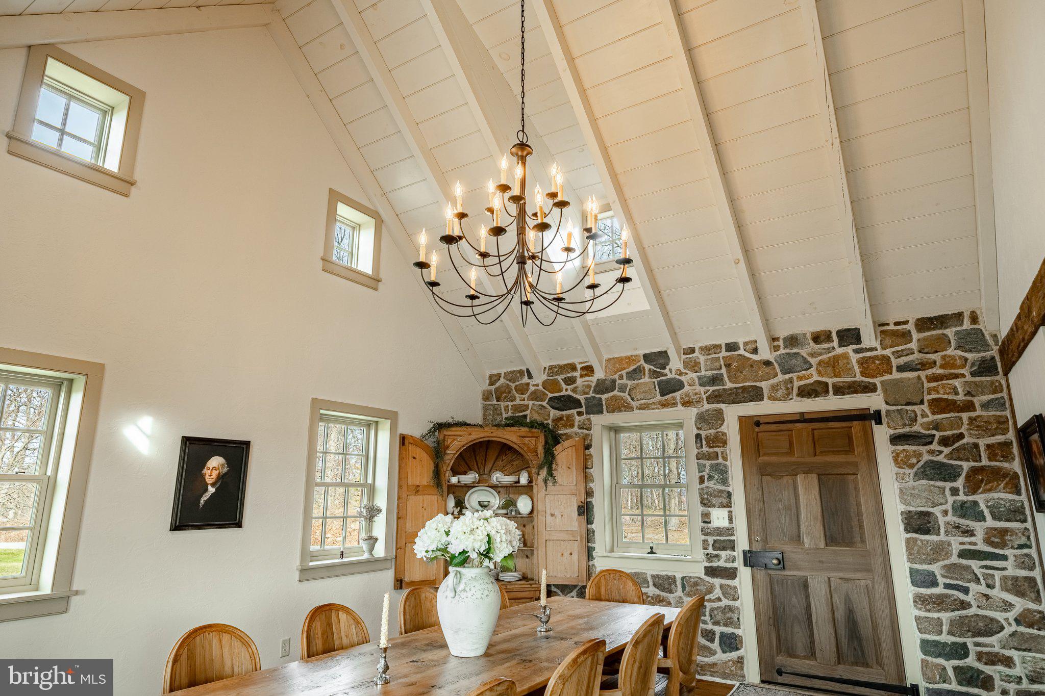 202 Privet Lane Elverson, PA 19520 - Photo 35 of 78 a view of a dining room with furniture wooden floor and chandelier