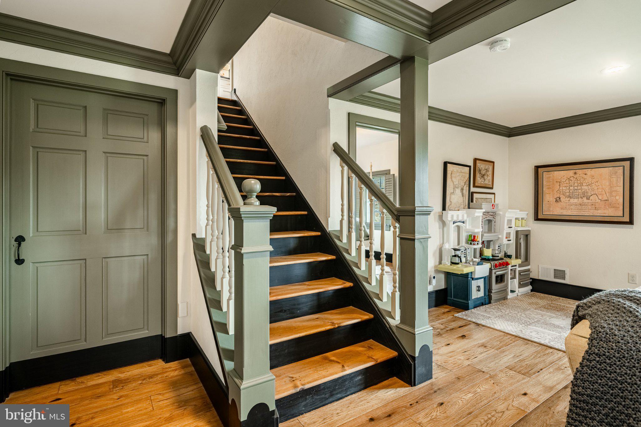 202 Privet Lane Elverson, PA 19520 - Photo 60 of 78 a view of a livingroom with wooden floor and stairs