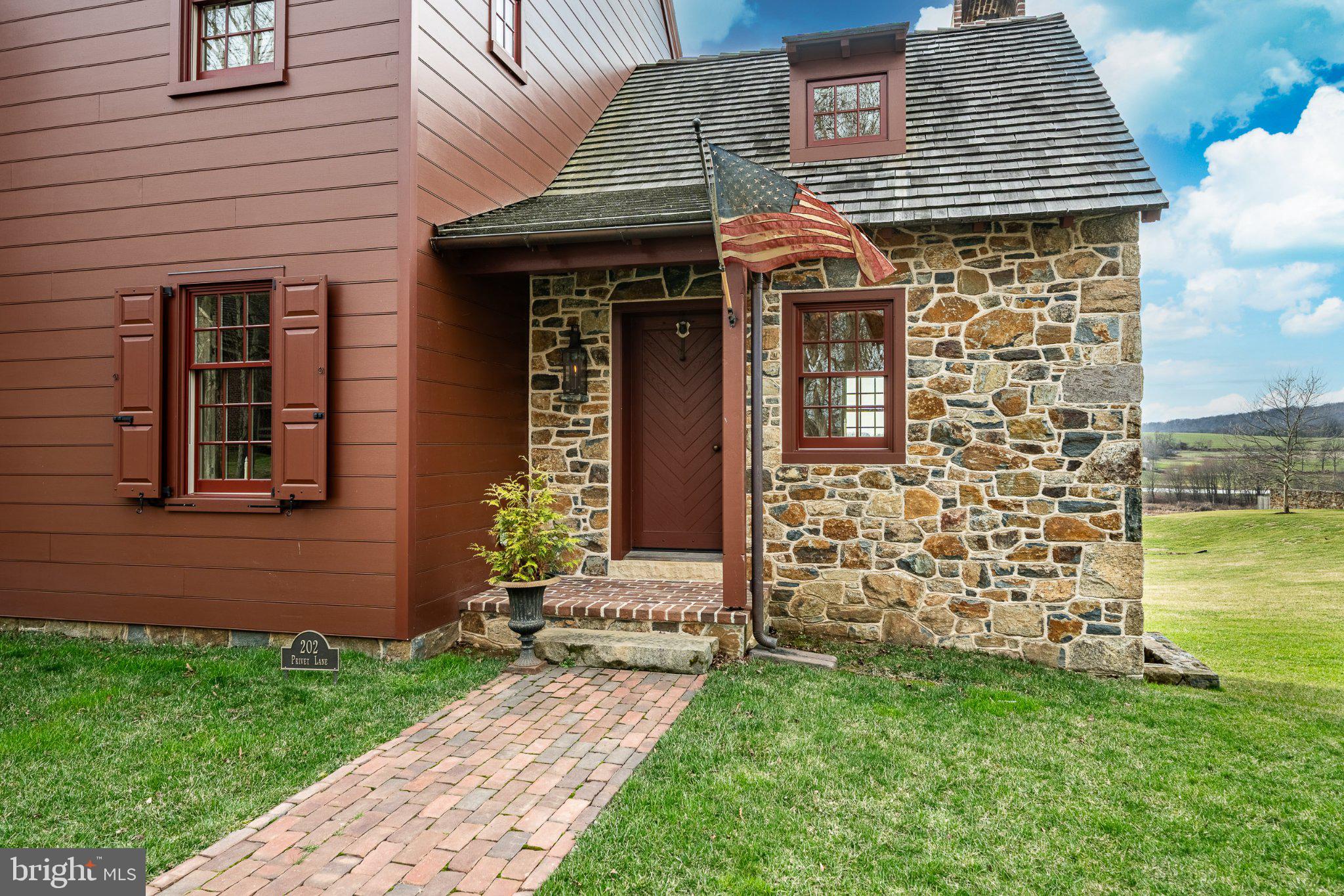 202 Privet Lane Elverson, PA 19520 - Photo 8 of 78 a front view of a house with garden
