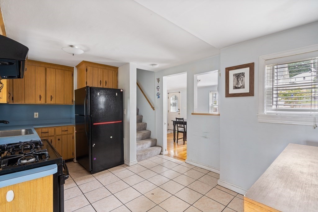63 Hallron Street Boston, MA 02136 - Photo 13 of 32 a kitchen with stainless steel appliances granite countertop a refrigerator and a stove top oven