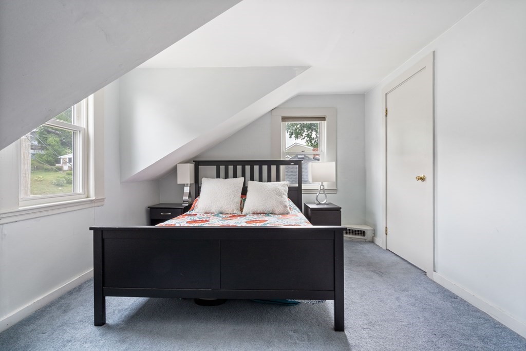 63 Hallron Street Boston, MA 02136 - Photo 15 of 32 a bedroom with a bed and window