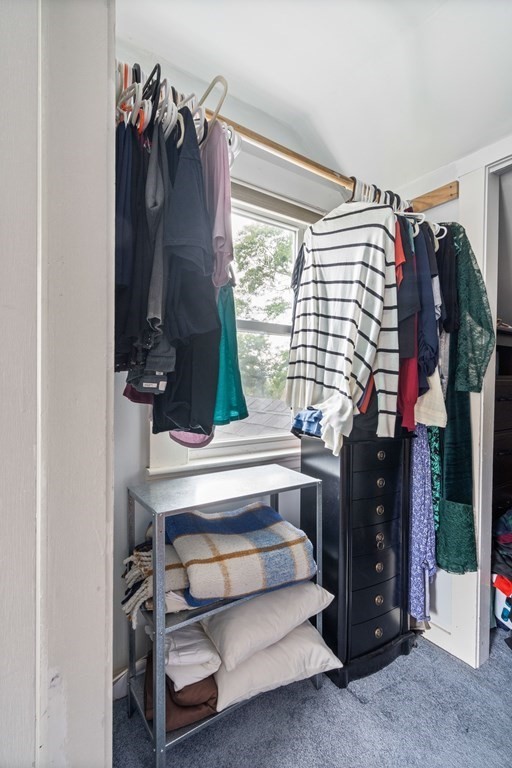 63 Hallron Street Boston, MA 02136 - Photo 17 of 32 a view of walk in closet with clothes and shoes
