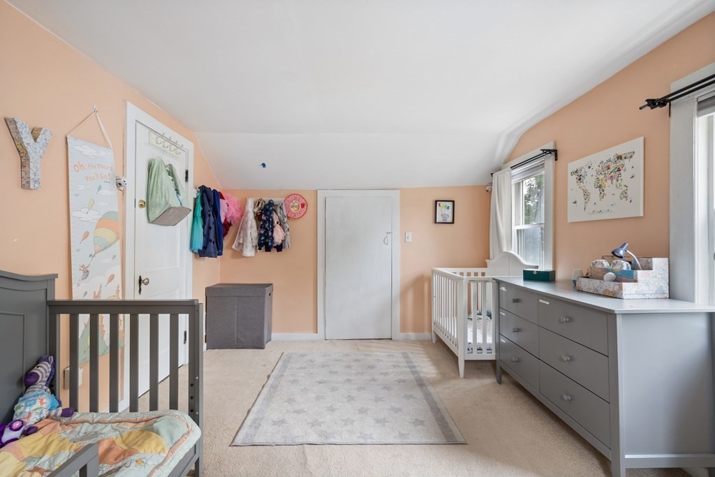 63 Hallron Street Boston, MA 02136 - Photo 21 of 32 a living room with furniture and baby crib