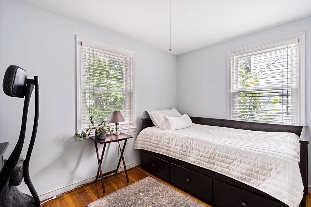 63 Hallron Street Boston, MA 02136 - Photo 22 of 32 a bedroom with furniture and a window