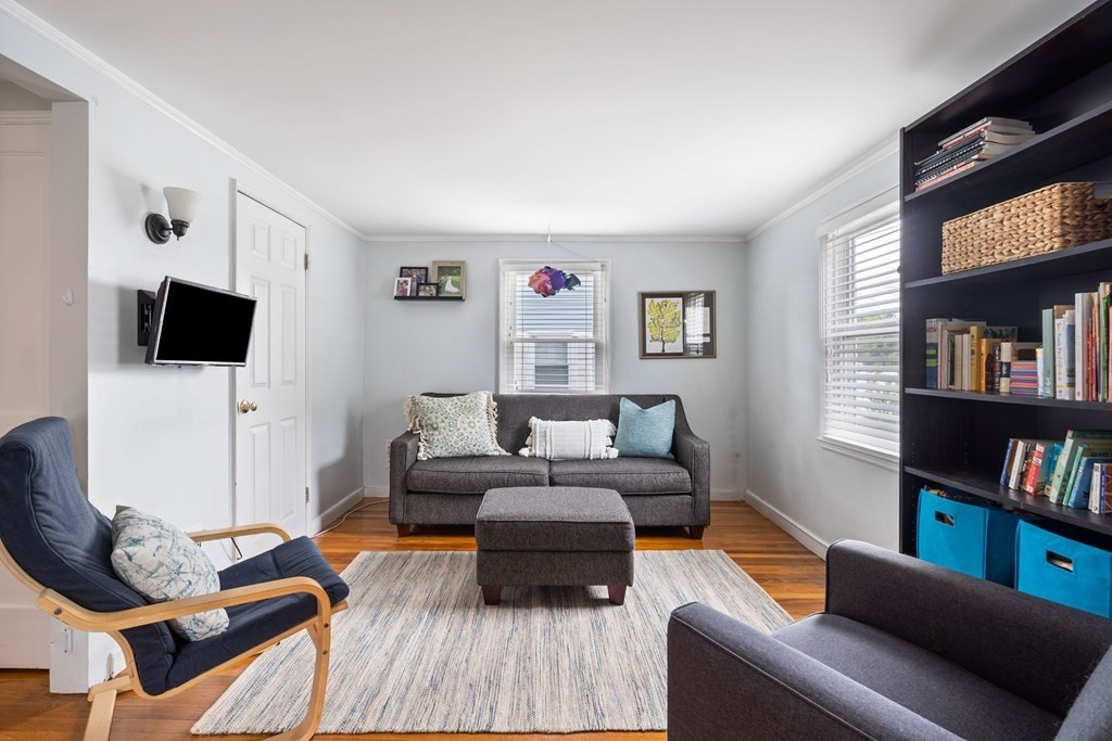 63 Hallron Street Boston, MA 02136 - Photo 3 of 32 a living room with furniture and a flat screen tv