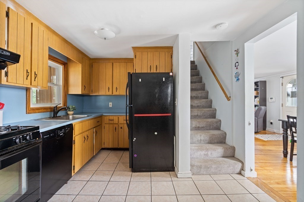 63 Hallron Street Boston, MA 02136 - Photo 8 of 32 a kitchen with stainless steel appliances granite countertop a refrigerator and a stove top oven