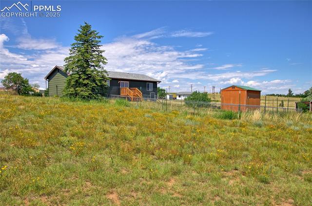 18535 Sage Crest Road Peyton, CO 80831 - Photo 4 of 24 Back yard includes dog fencing and a storage shed