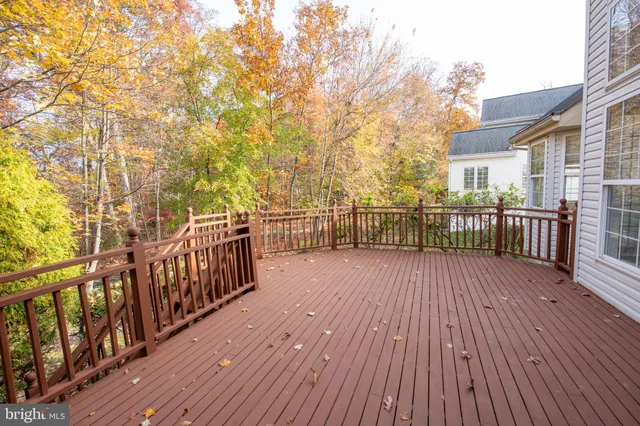 a view of a chandelier in big room and windows